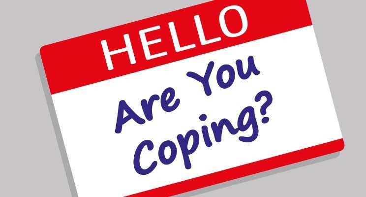 Post it note (red and white) saying Hello - are you coping?