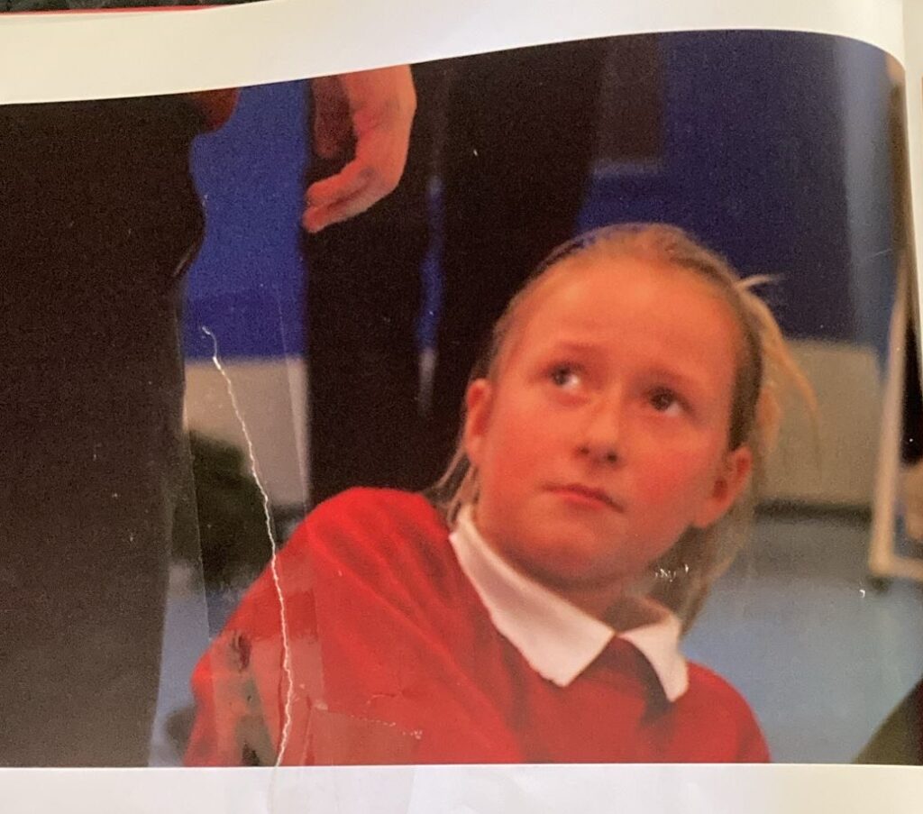 Photo of 10 year old Rosie Boother in a photo book, in Macbeth in a Workshop.